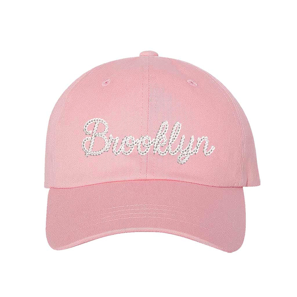 Light Pink Brooklyn Chain Stitch Embroidered Baseball Hat with detailed chain stitch embroidery, a curved brim, and an adjustable strap, perfect for Brooklyn lovers and streetwear fans - DSY Lifestyle