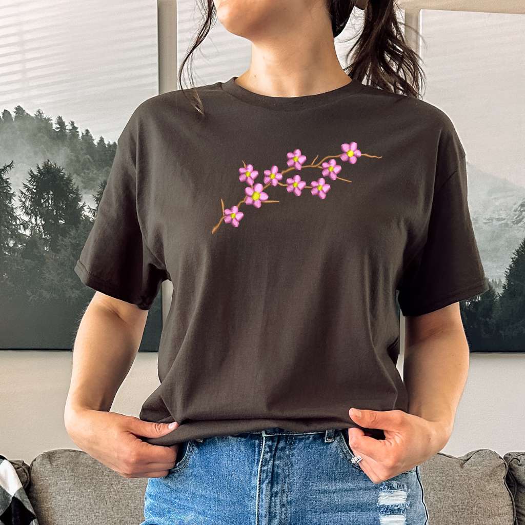 Female wearing a brown shirt embroidered with a cherry blossom - DSY Lifestyle