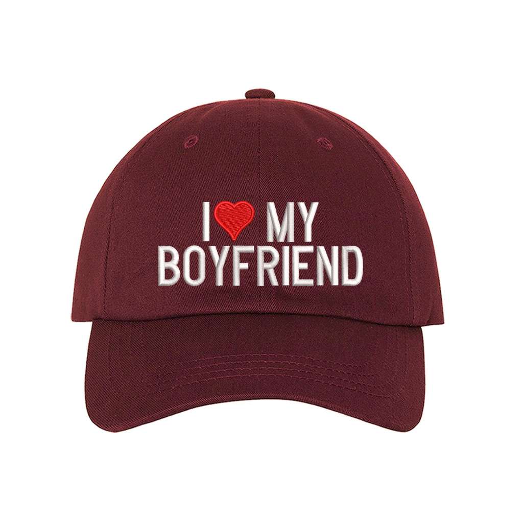 Burgundy baseball hat embroidered with the phrase I love my boyfriend but love is a heart- DSY Lifestyle