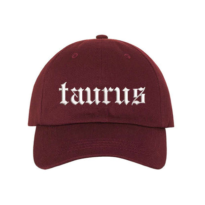 Burgundy baseball hat embroidered with the word taurus in english writing on it-DSY Lifestyle