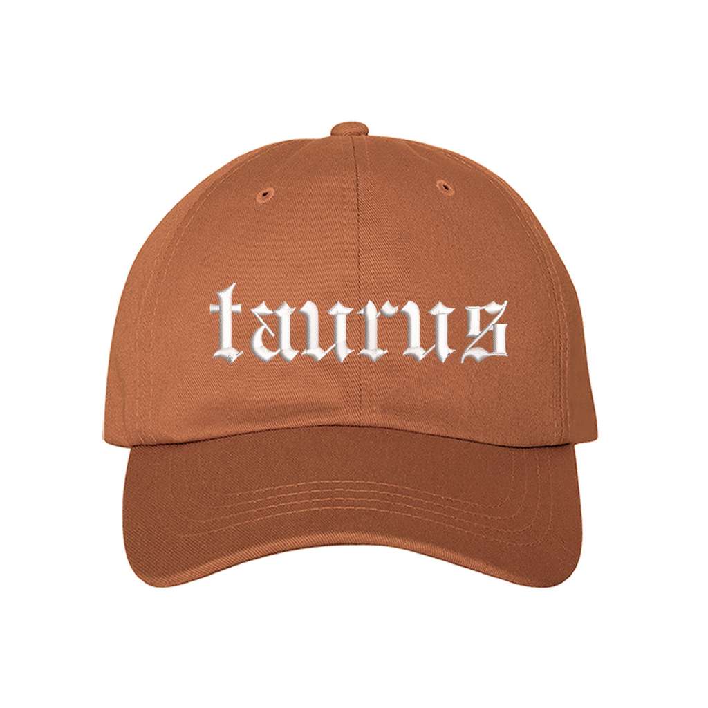 Burnt orange baseball hat embroidered with the word taurus in english writing on it-DSY Lifestyle