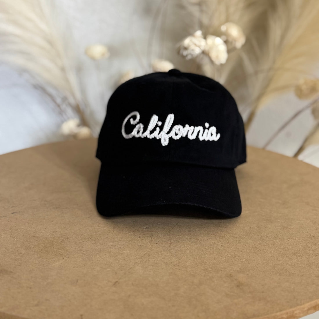 Black California Chain Stitch Embroidered Baseball Hat with handcrafted embroidery, a curved brim, and an adjustable strap for a stylish and comfortable fit - DSY Lifestyle