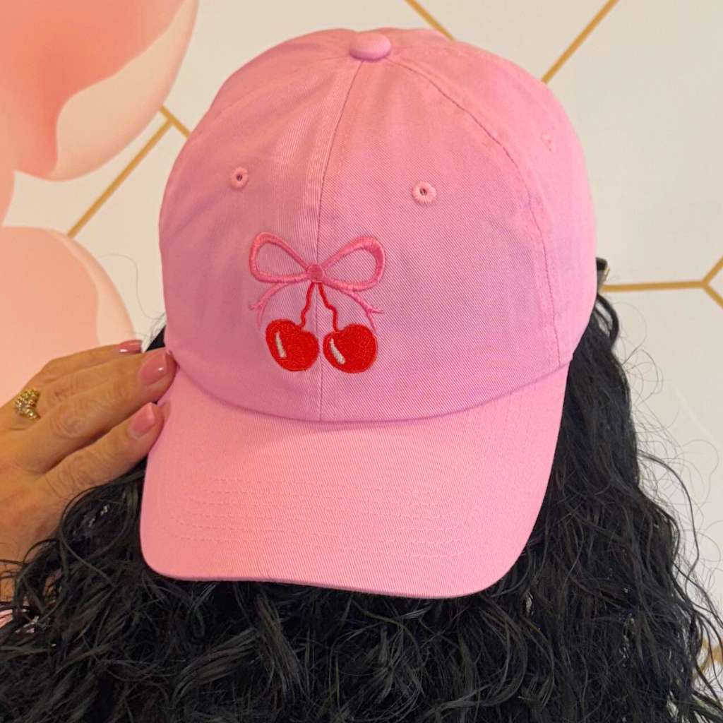 Women wearing a Pink baseball hat embroidered with a cherry and bow - DSY Lifestyle