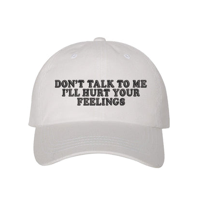 White baseball hat embroidered with the phrase don&