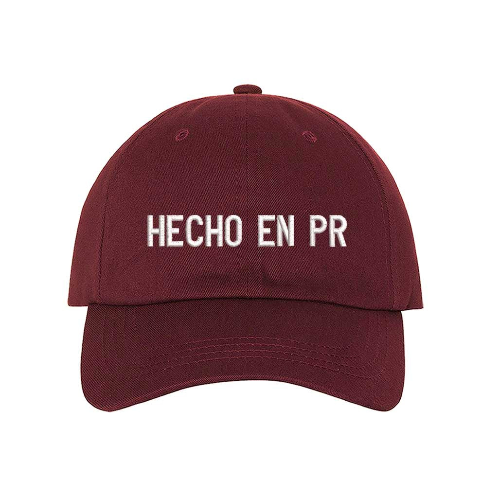 Burgundy embroidered baseball hat with &quot;Hecho En PR&quot; stitched in bold lettering, representing Puerto Rican pride and heritage - DSY Lifestyle