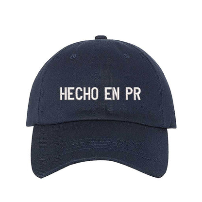 Navy Blue embroidered baseball hat with &quot;Hecho En PR&quot; stitched in bold lettering, representing Puerto Rican pride and heritage - DSY Lifestyle