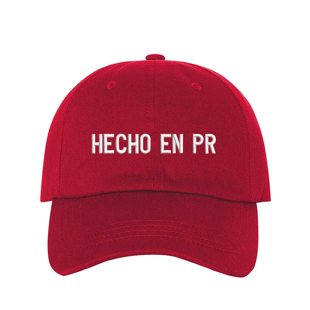 Red embroidered baseball hat with &quot;Hecho En PR&quot; stitched in bold lettering, representing Puerto Rican pride and heritage - DSY Lifestyle