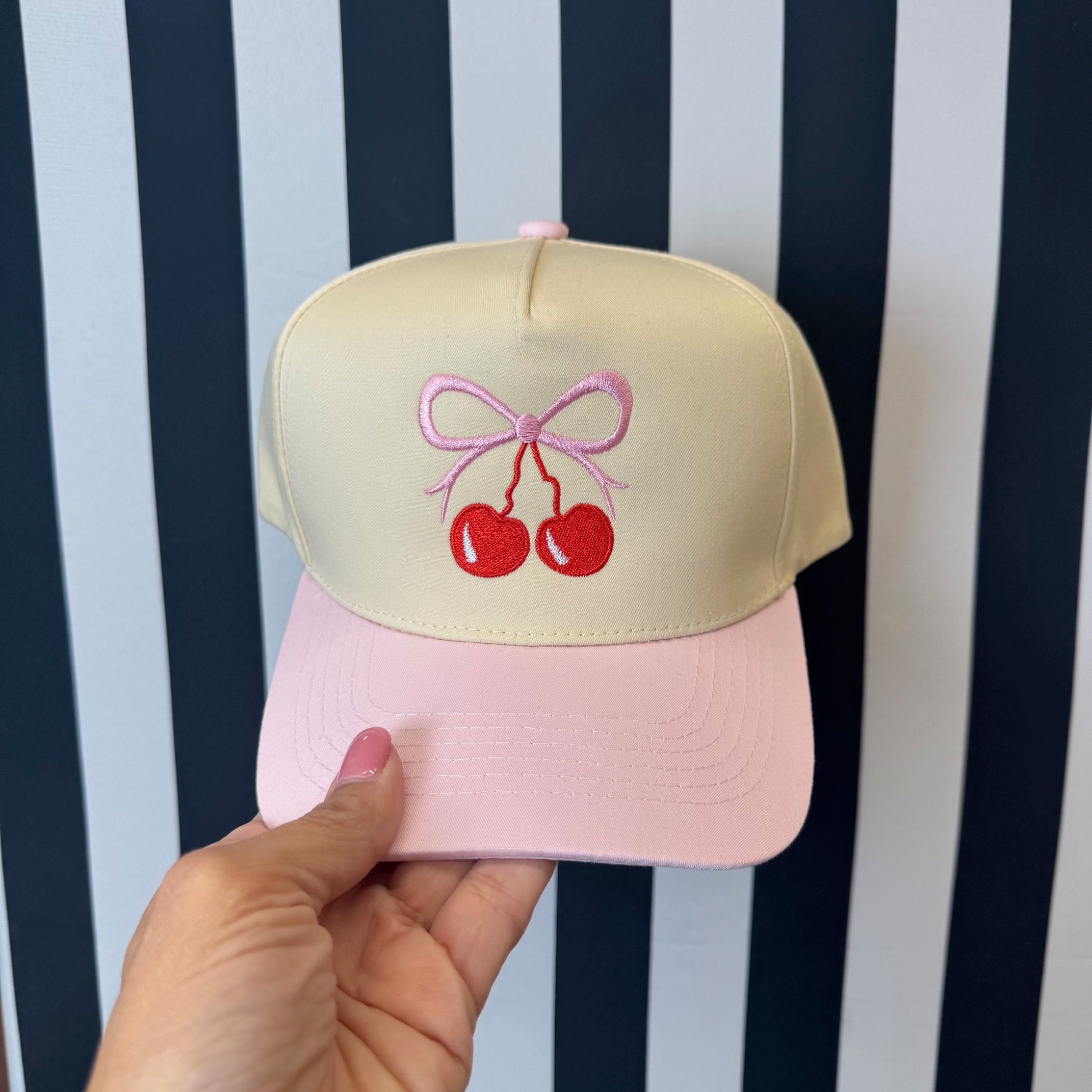 Natural colored  5 panel baseball hat with light pink bill embroidered with a cherry bow-DSY Lifestyle