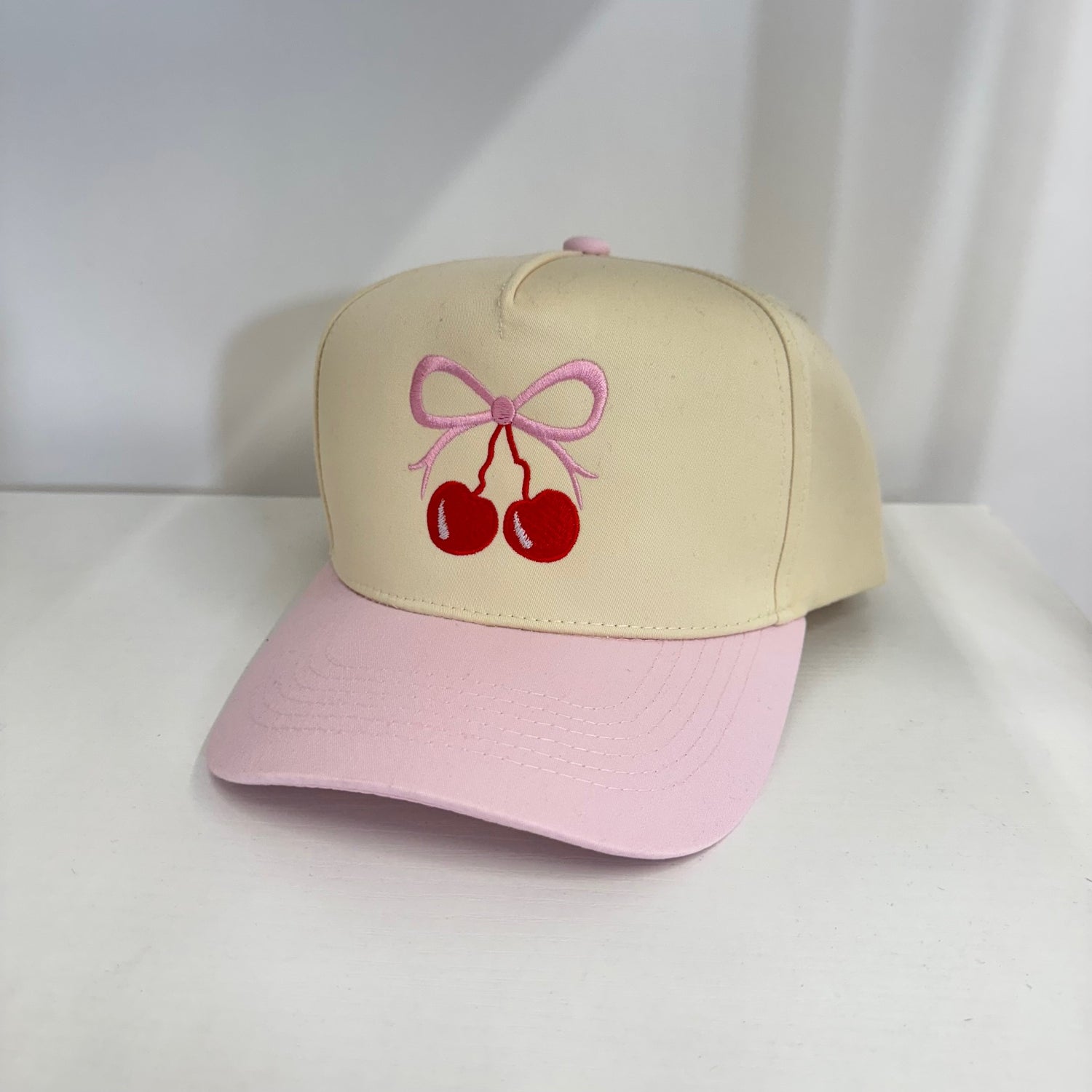 Natural colored  5 panel baseball hat with light pink bill embroidered with a cherry bow-DSY Lifestyle