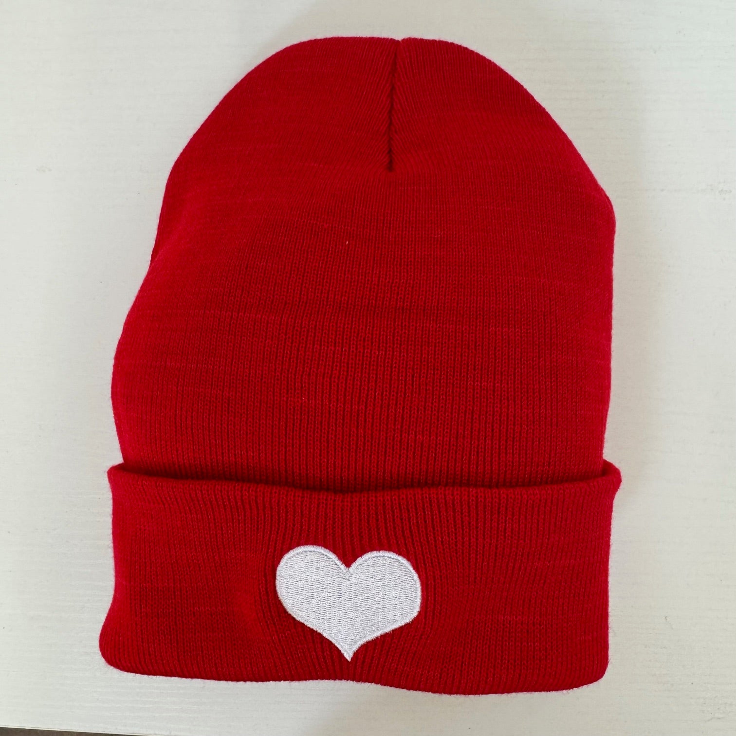 Red colored beanies with white heart embroidered on it-DSY Lifestyle