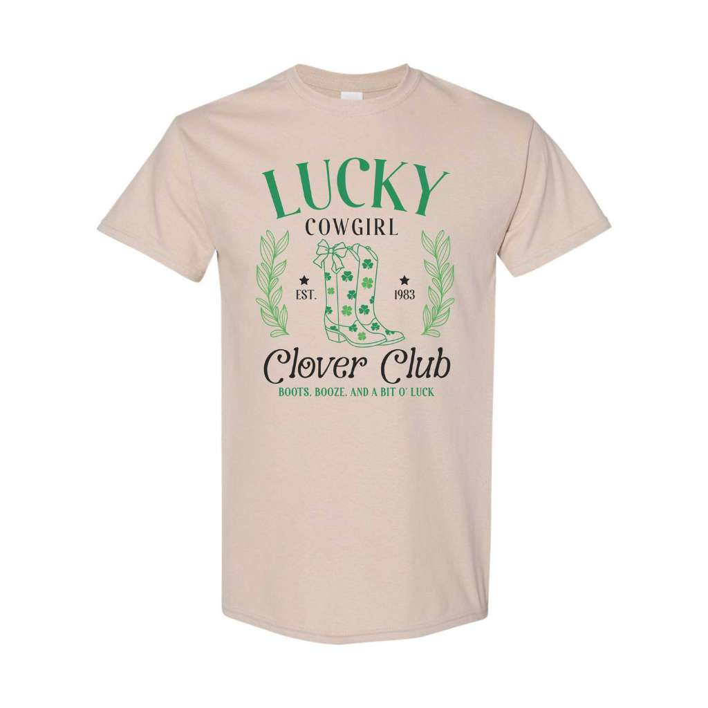 Woman wearing a sand color unisex shirt with Lucky Cowgirl with boots clover club for St Patricks Day - DSY Lifestyle