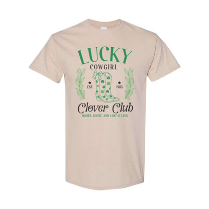 Woman wearing a sand color unisex shirt with Lucky Cowgirl with boots clover club for St Patricks Day - DSY Lifestyle