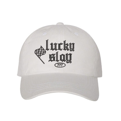 White baseball hat embroidered with the phrase lucky slay-DSY Lifestyle