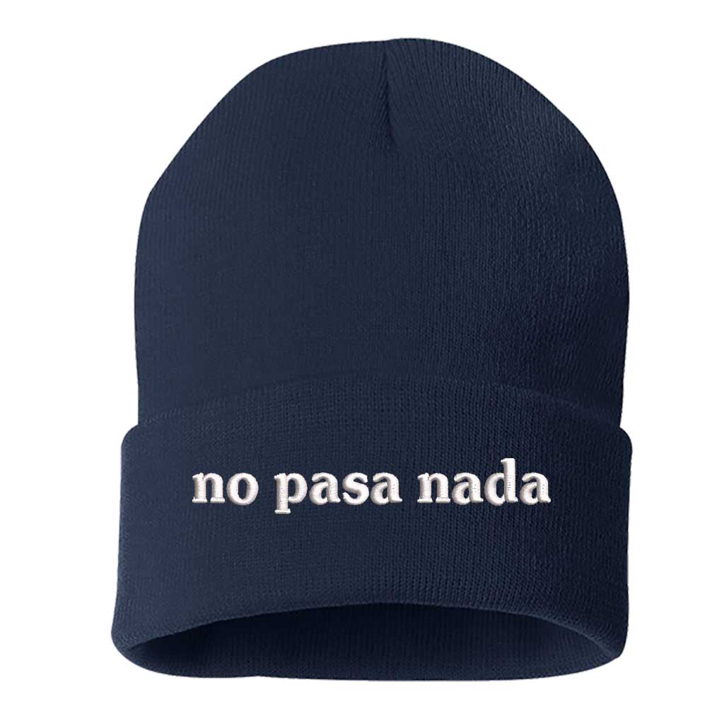 Flat lay of No Pasa Nada Spanglish navy beanie, a cozy winter hat with chill vibes