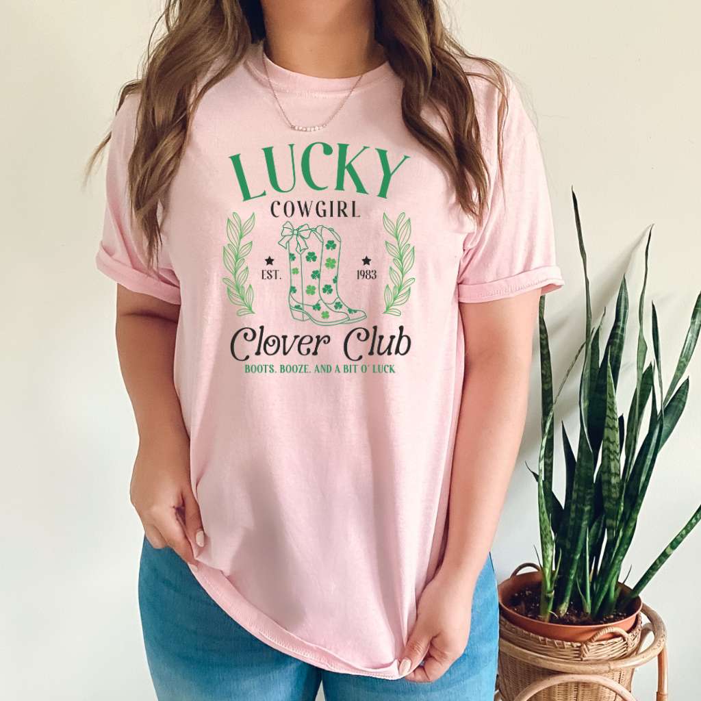 Woman wearing a pink color unisex shirt with Lucky Cowgirl with boots clover club for St Patricks Day - DSY Lifestyle