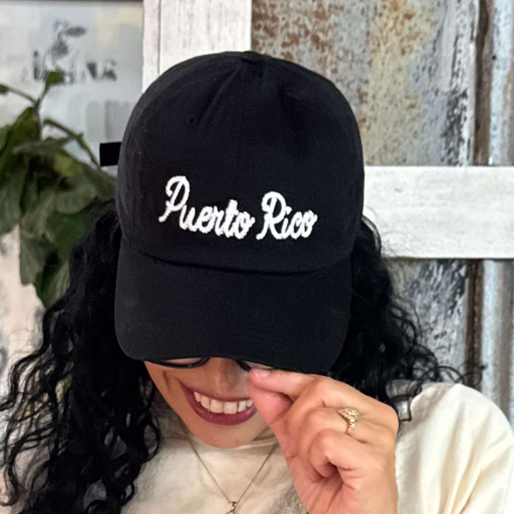 Woman wearing a black Puerto Rico embroidered Baseball Cap - DSY Lifestyle