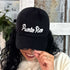 Woman wearing a black Puerto Rico embroidered Baseball Cap - DSY Lifestyle