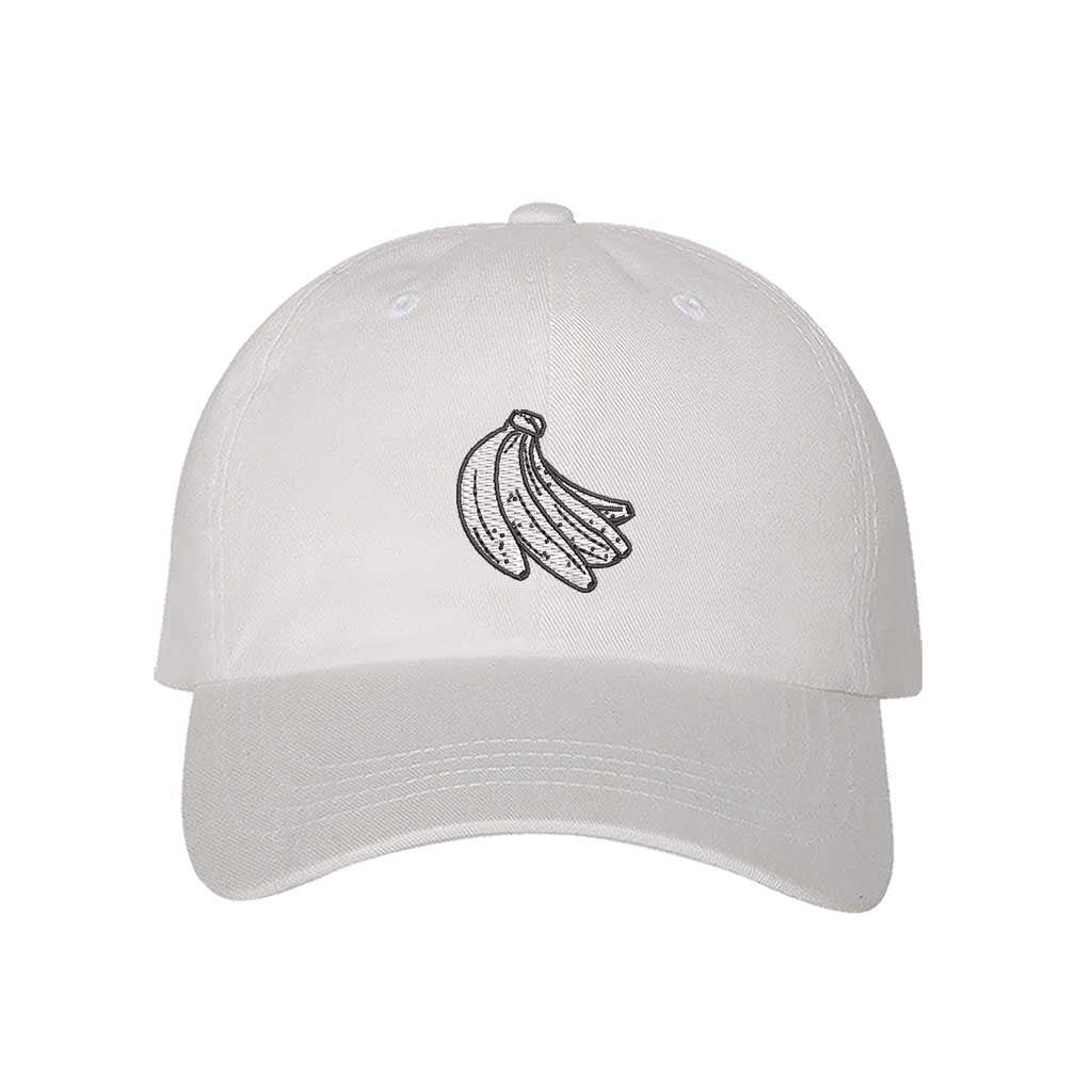 White baseball hat with “Plátanos” embroidered in bold lettering, celebrating Puerto Rican culture with a fun and stylish touch - DSY Lifestyle