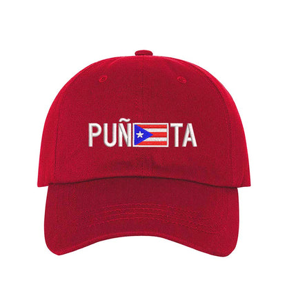 Red embroidered baseball hat with &quot;Puñeta&quot; in bold lettering, featuring the Puerto Rican flag as the letter &quot;E,&quot; representing Boricua pride and culture - DSY Lifestyle