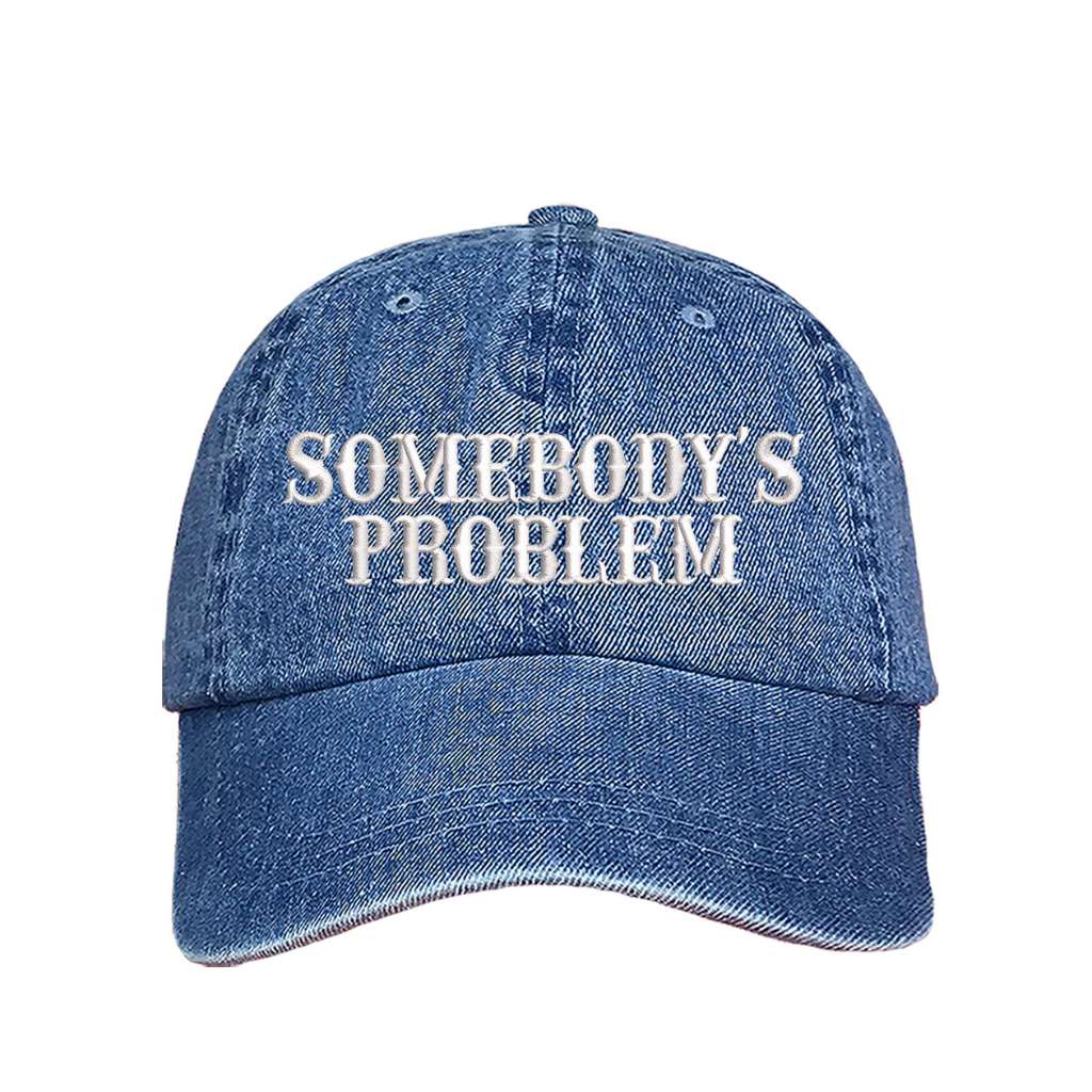 Denim baseball hat embroidered with the phrase somebody&