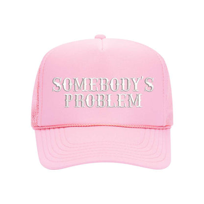 Light pink foam trucker hat embroidered with the phrase somebody&