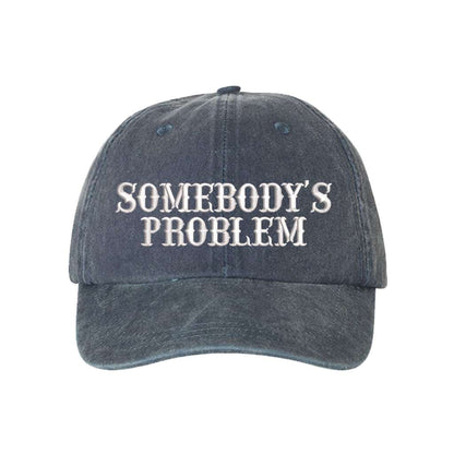 Washed Navy Blue baseball hat embroidered with the phrase somebody&