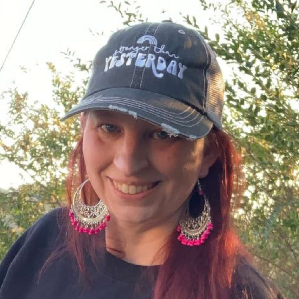 Stronger than Yesterday Trucker hat embroidered women wearing it.