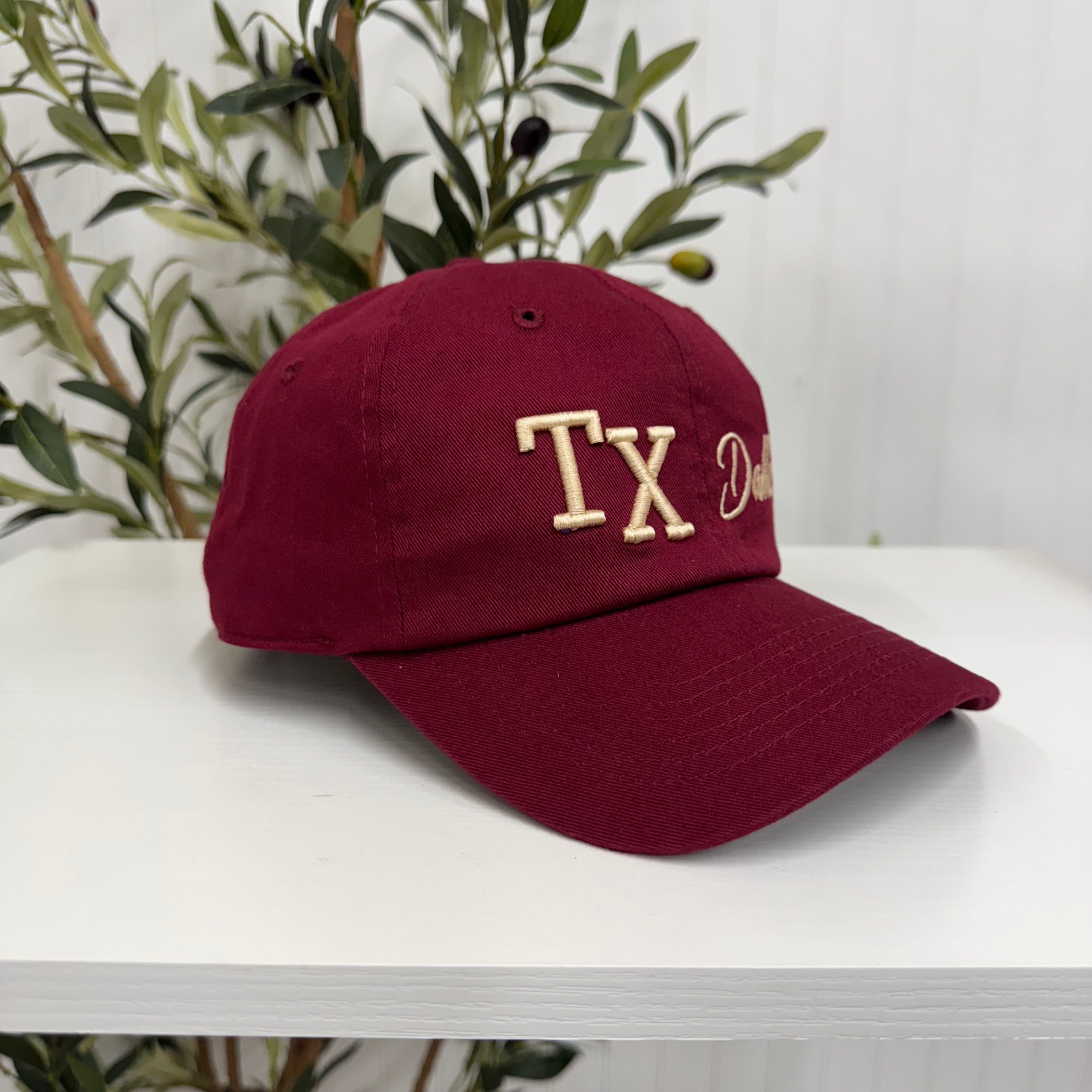 Burgundy side view TX 3D Dallas Embroidered Baseball Cap with raised 3D embroidery of &quot;Dallas&quot;, a curved brim, and an adjustable strap, designed for comfort and everyday wear - DSY Lifestyle