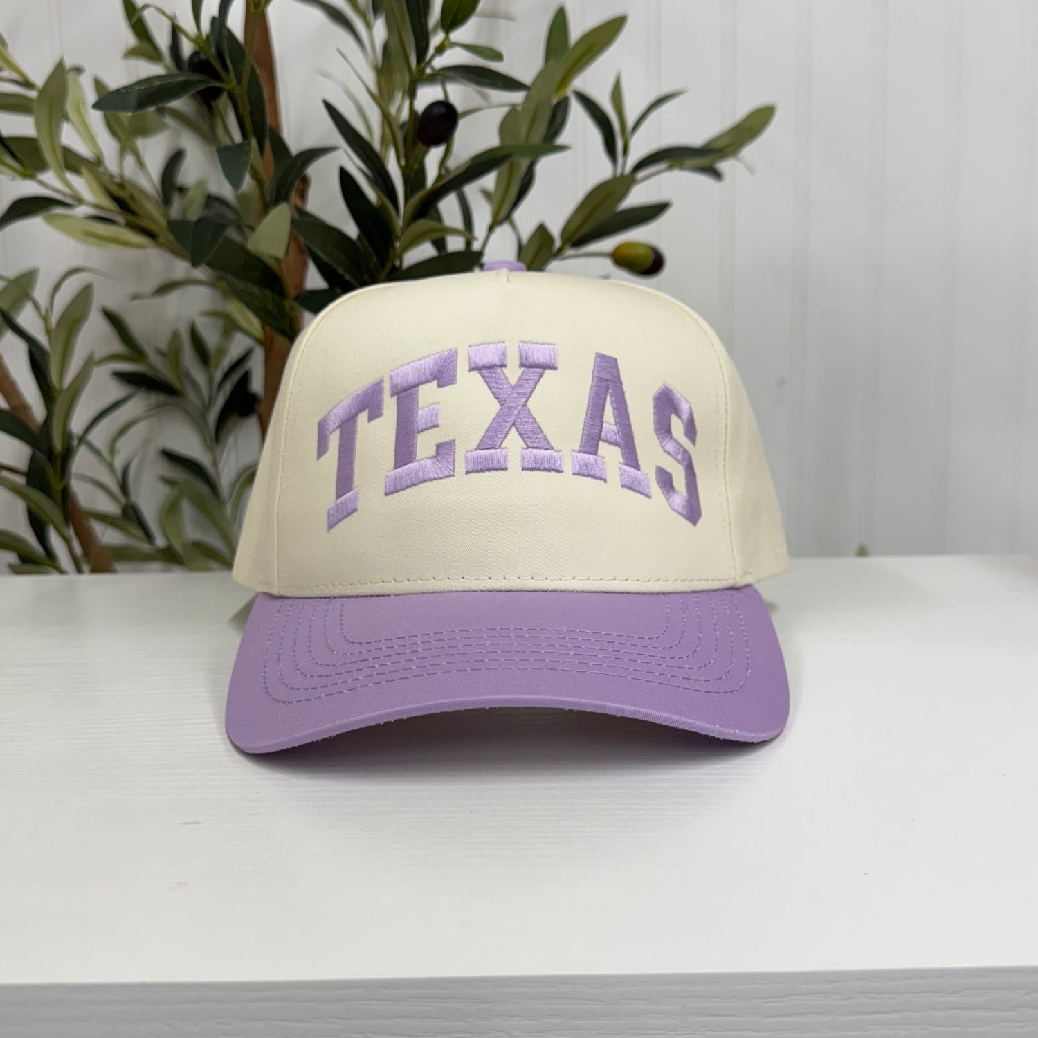 Lavender Texas Arched 5-Panel Two-Tone Embroidered Baseball Cap with bold arched Texas embroidery, a curved brim, and an adjustable strap, perfect for spring and everyday wear - DSY Lifestyle