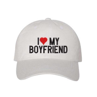 White baseball hat embroidered with the phrase I love my boyfriend but love is a heart- DSY Lifestyle