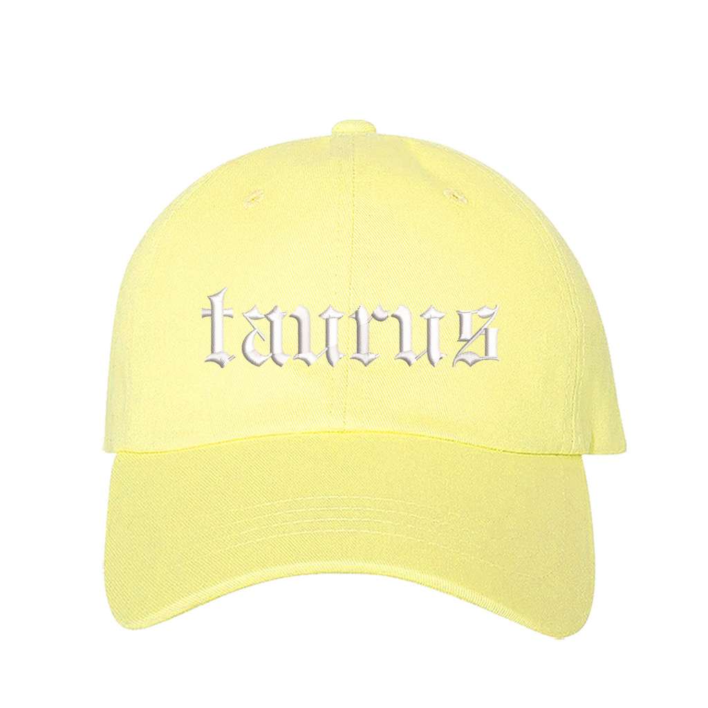 Yellow baseball hat embroidered with the word taurus in english writing on it-DSY Lifestyle