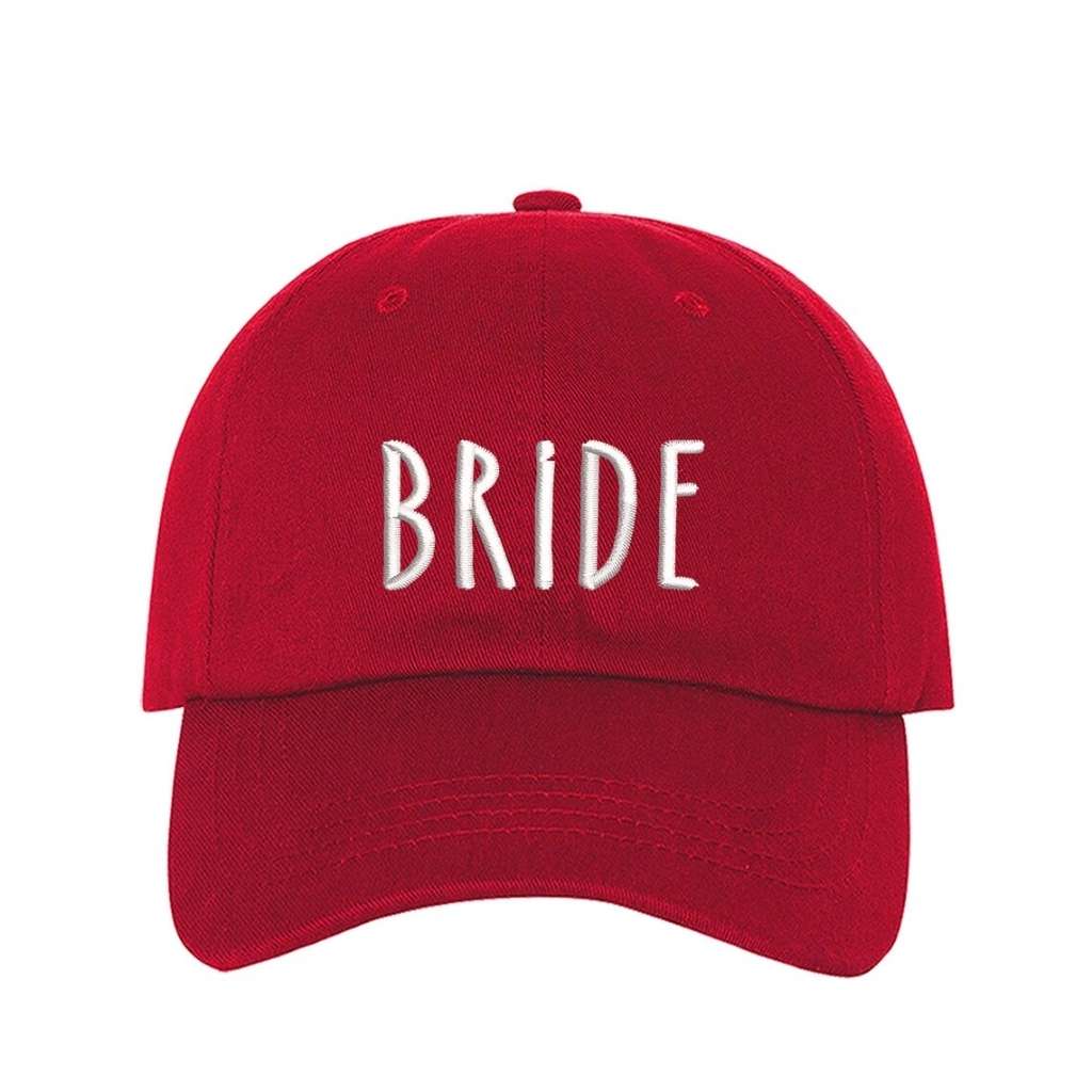 Red embroidered baseball hat with Bride stitched in elegant script, ideal for bachelorette parties, wedding planning, and honeymoon outfits - DSY Lifestyle