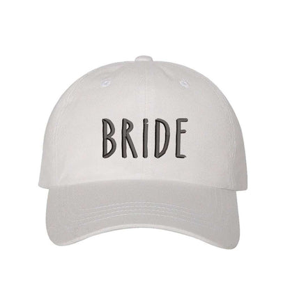 White embroidered baseball hat with Bride stitched in elegant script, ideal for bachelorette parties, wedding planning, and honeymoon outfits - DSY Lifestyle