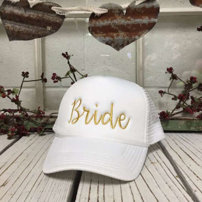 White stylish white trucker hat with Bride embroidered in elegant gold thread, featuring a breathable mesh back for a comfy yet chic bridal look - DSY Lifestyle