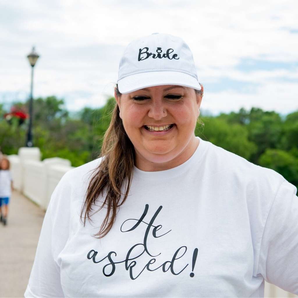 White embroidered baseball hat featuring the word Bride with a delicate engagement ring design, perfect for bridal celebrations and honeymoon outfits - DSY Lifestyle