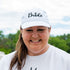 White embroidered baseball hat featuring the word Bride with a delicate engagement ring design, perfect for bridal celebrations and honeymoon outfits - DSY Lifestyle