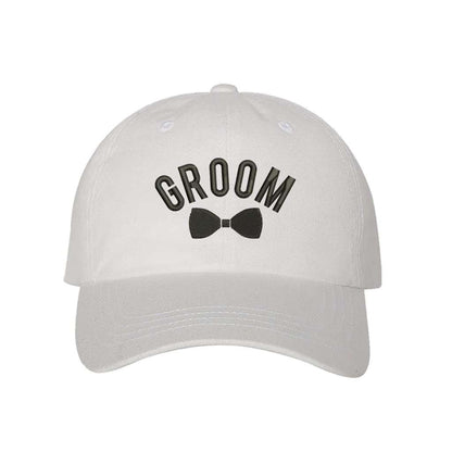 White stylish embroidered baseball hat featuring the word Groom with a bow design, perfect for grooms celebrating their wedding journey in a trendy way - DSY Lifestyle