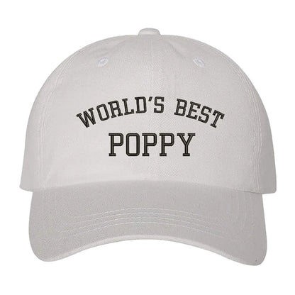 White baseball hat embroidered with the phrase world best poppy- DSY Lifestyle