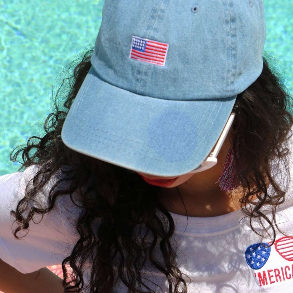 Model wearing light denim baseball hat with USA Flag embroidered on the front - DSY Lifestyle