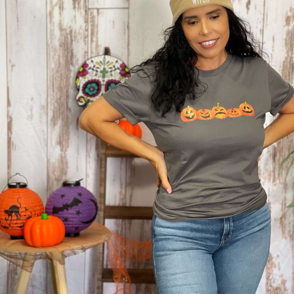 Female wearing a gray Unisex Tshirt with 5 pumpkin printed in the front - DSY Lifestyle