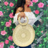 Female holding a Circular Straw Purse - DSY Lifestyle