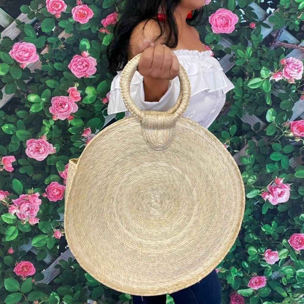 Female holding a Circular Straw Purse - DSY Lifestyle